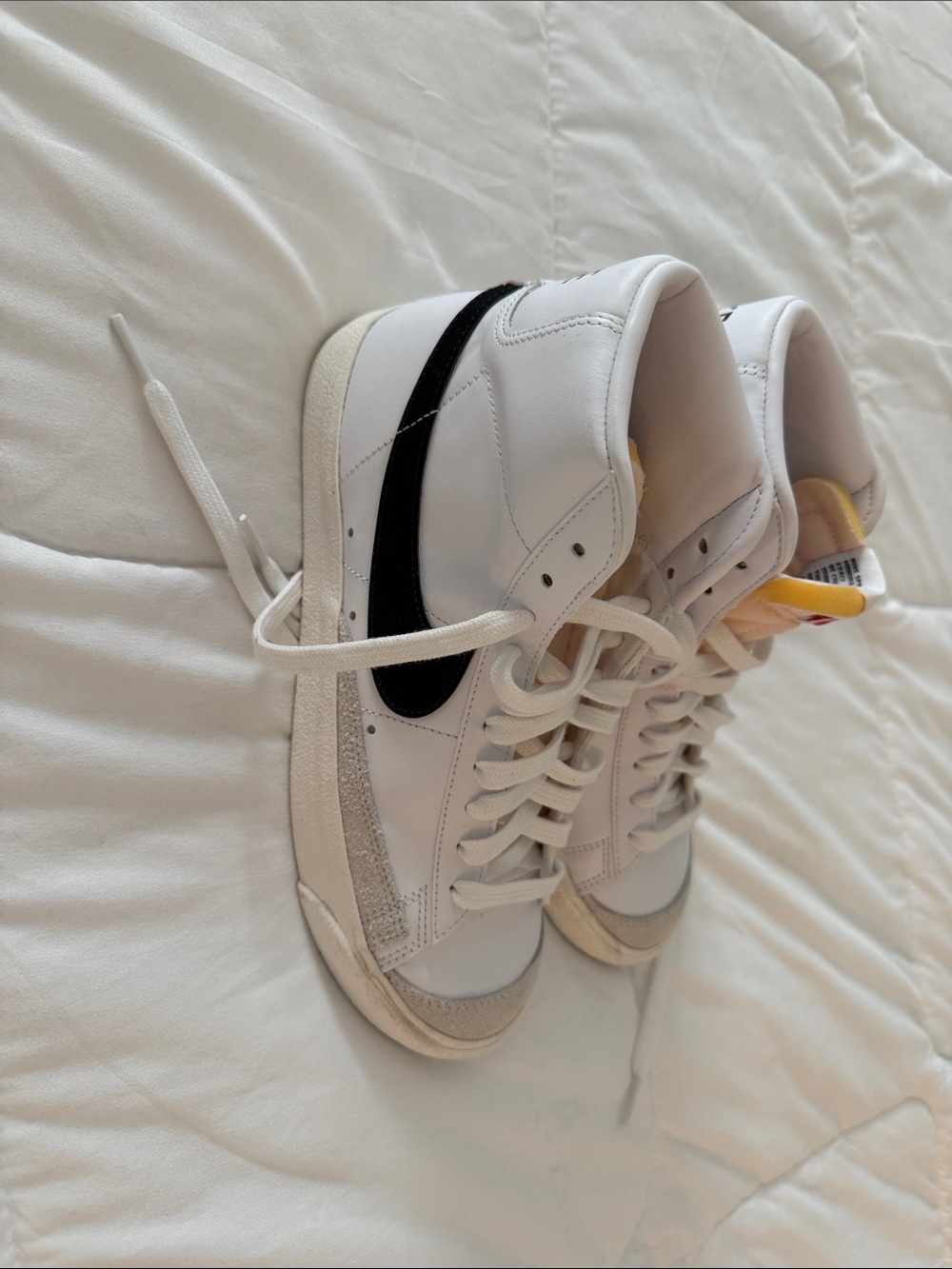 Nike White High-Top Sneakers with Black Swoosh and Cream Accents
